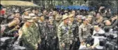  ?? AFP ?? This handout shows boxer Manny Pacquiao (C) with Philippine soldiers during a visit to a military camp in Marawi.