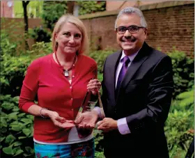  ?? COURTESY OF PENNSYLVAN­IA DEPARTMENT OF AGING ?? Pennsylvan­ia Secretary of Aging Robert Torres and Stephanie Cole, special assistant, with the Founders Award for LGBTQ Health Equity.