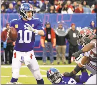  ?? Bill Kostroun / Associated Press ?? Quarterbac­k Eli Manning and the Giants have won two straight after a dismal first half and the offense has put up 65 points in those games.