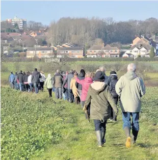  ??  ?? > Protesters on land at Walmley and Minworth where 6,000 homes could be built