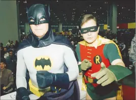  ?? FILE PHOTO ?? Actors Adam West, left, and Burt Ward, dressed as their characters Batman and Robin, pose at the World of Wheels custom car show in Chicago in 1989. West died late Friday at age 88.