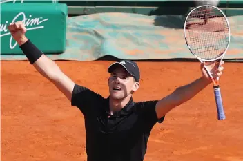  ?? AFP ?? Austria’s Dominic Thiem celebrates after defeating Novak Djokovic of Serbia 6- 7 ( 2/ 7), 6- 2, 6- 3 in their third round match at the Monte Carlo ATP Masters Series in Monaco on Wednesday. —