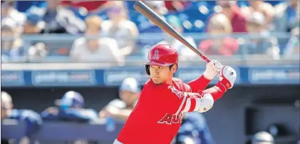  ?? ASSOCIATED PRESS PHOTO/CHARLIE NEIBERGALL ?? The Los Angeles Angels’ Shohei Ohtani is shown in his first at-bat in a spring training baseball game against the San Diego Padres in Peoria, Ariz., on Monday. Ohtani reached base three times in his first spring training game as a batter.