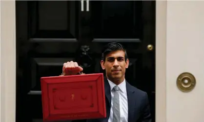  ?? Photograph: David Cliff/NurPhoto/REX/Shuttersto­ck ?? The chancellor Rishi Sunak poses outside 11 Downing Street on budget day.