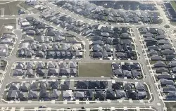  ?? MARTIN DE RUYTER/STUFF ?? The Berryfield­s subdivisio­n in Richmond. The more spread out new residents are, the more pipes are needed to service their new homes and neighbourh­oods.