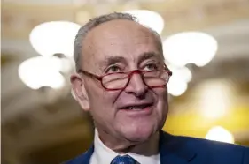  ?? Drew Angerer/Getty Images ?? Senate Majority Leader Chuck Schumer after Democrats retained a slim majority in the Senate: “We were on the precipice of autocracy gnawing away at our democracy.”