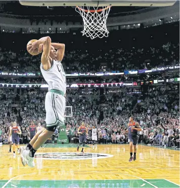  ?? AFP ?? The Celtics’ Avery Bradley dunks against the Wizards during the first half of Game Five.