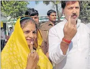  ?? ?? Dhananjai Singh and his wife after casting their vote in Jaunpur.