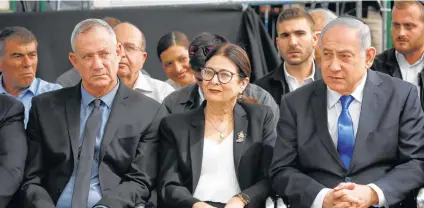  ?? Ariel Schalit / Associated Press ?? Blue and White leader Benny Gantz, left, Esther Hayut, chief justice of Israel’s supreme court, and Prime Minister Benjamin Netanyahu attend a memorial service for former President Shimon Peres on Thursday.