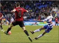  ??  ?? BATTLING ROYALS: Lucas Piazon fires past James Chester to cap Reading’s win