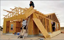  ?? FILE PHOTO ?? PARTICIPAN­TS IN A SELF-HELPING HOUSING PROGRAM build their home in San Luis, Ariz. The city’s mayor predicts the city’s population will jump in the next several years.