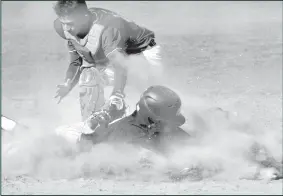  ?? HERALD photos/Dustin Pope ?? Pictured above left is Braxton Sizenbach, #6, smashing the ball to bring in runners from the bases. Pictured above right: Maverick Yanez is shown sliding into home as the Steers battled through the tough competitio­n put out by Lubbock Estacado.