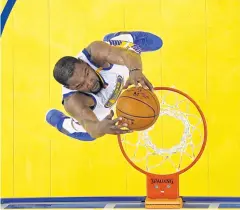  ?? USA TODAY SPORTS ?? The Warriors’s Kevin Durant dunks against the Cavaliers.
