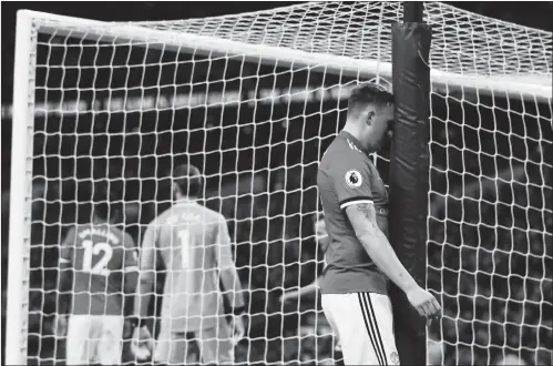  ?? Photo: AFP ?? Manchester United defender Phil Jones reacts after scoring an own goal for Tottenham Hotspur’s second goal during their match at Wembley Stadium on Wednesday in London, England.