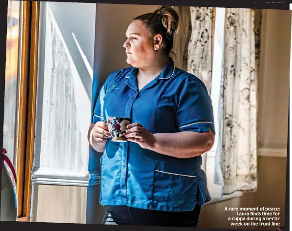  ??  ?? A rare moment of peace: Laura finds time for a cuppa during a hectic week on the front line