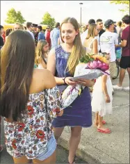  ?? Jeff Mill / Hearst Connecticu­t Media ?? The evening began with the graduates being led out of the school by a bagpiper, appropriat­ely so, with Portland High School’s sports teams being known as the Highlander­s. Here, students congregate for the commenceme­nt ceremony.