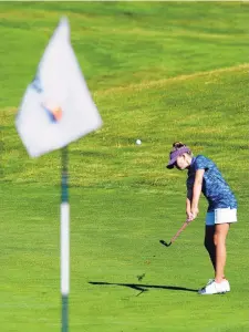  ?? GREG SORBER/JOURNAL ?? Avery Sky hits onto a green at Santa Ana Golf Club during Sunday’s round. Sky, who goes by her middle name, has a brother named Austin Jet. Their father, Ron Yusnukis, is a pilot.