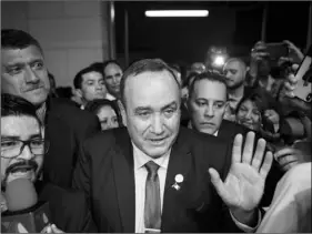  ??  ?? Alejandro Giammatei, presidenti­al candidate of the Vamos party, arrives to the Electoral Supreme Court headquarte­rs for interviews with the press after partial election results were announced in Guatemala City, on Sunday. AP PHOTO/OLIVER DE ROS