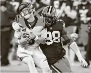  ?? David Richard / Associated Press ?? Browns defensive tackle Sheldon Richardson sacks Bengals quarterbac­k Joe Burrow in the first half.