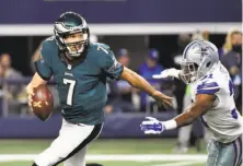  ?? Michael Ainsworth / Associated Press 2015 ?? Philadelph­ia quarterbac­k Sam Bradford tries to avoid Dallas’ Byron Jones. Bradford now wants to escape from the Eagles.