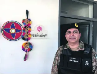  ?? Photos Colin Freeman for The National ?? Major General Hassan Hayat has become a trailblaze­r for women’s liberation. He visits the embroidery classroom at the newly built school in Miranshah.