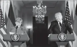  ?? ASSOCIATED PRESS ?? PRESIDENT DONALD TRUMP and German Chancellor Angela Merkel participat­e in a joint news conference in the East Room of the White House in Washington Friday.