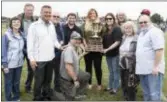  ?? JOHN BLAINE/ FOR THE TRENTONIAN ?? Administra­tors from Steinert are presented with George O’Gorman Trophy by members of the O’Gorman family during halftime of the game between Nottingham and Steinert.