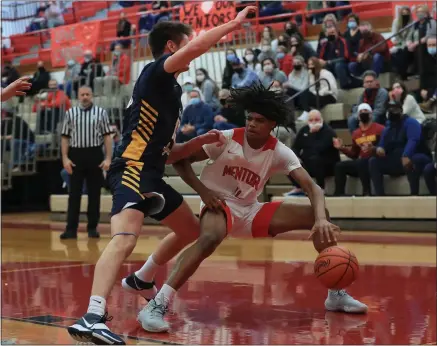  ?? TIM PHILLIS — FOR THE NEWS-HERALD ?? Mentor’s Steven Key looks for room against a St. Ignatius defender Feb. 20.