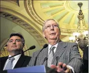  ?? ALEX WONG / GETTY IMAGES ?? U.S. Senate Majority Leader Sen. Mitch McConnell, R-Ky., (right) speaks during a news briefing after the Senate Republican weekly luncheon on Tuesday at the Capitol in Washington, D.C.