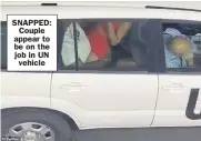  ??  ?? SNAPPED: Couple appear to be on the job in UN vehicle