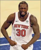  ?? Elsa / Associated Press ?? The Knicks' Julius Randle celebrates after drawing a foul late in the fourth quarter against the Pacers on Saturday in New York.