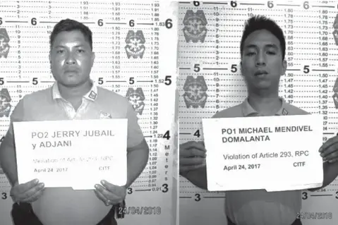  ??  ?? MANILA. Counter-Intelligen­ce Task Force conducted an entrapment operation against these two officers, who have been extorting from drivers of colorum vans and buses at an illegal terminal in Pasay City, Metro Manila. (Photo courtesy of PNP-CITF)