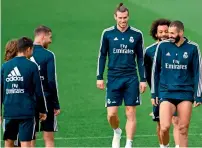  ?? AFP ?? Real Madrid’s players attend a training session. —