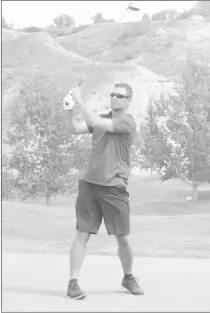  ?? Herald photo by Dale Woodard ?? Jamie Petrone watches his tee shot during the Hurricanes Golf Classic at the Paradise Canyon Golf Resort Monday afternoon.