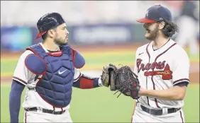  ?? Elsa / Getty Images ?? Ian Anderson, right, and Travis d’arnaud have been working well together. Now Anderson’s family will get to see him pitch in person.