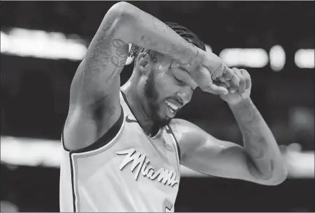  ??  ?? AP Miami forward Derrick Jones Jr has reportedly tested positive for the coronaviru­s, highlighti­ng the difficulti­es the NBA faces ahead of this month’s restart at the Disney complex in Orlando, Florida. Jones still plans to play when Miami gets back on the floor.