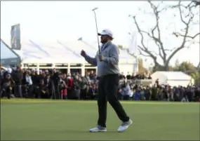  ?? RYAN KANG — THE ASSOCIATED PRESS ?? J.B. Holmes celebrates after making his putt on the 18th green to win the Genesis Open at Riviera Country Club Feb. 17.