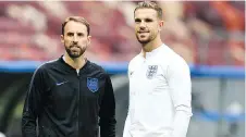  ?? YURI CORTEZ/AFP/GETTY IMAGES ?? England midfielder Jordan Henderson, right, will be looking for a measure of revenge after losing to Croatia’s Luka Modric in the Champions League final.