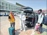  ?? RAJ K RAJ/HT PHOTO ?? A health worker collects a swab sample from a traveller at Kashmere Gate ISBT on Wednesday.