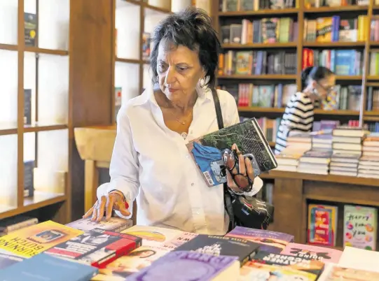  ?? MATIAS J. OCNER mocner@miamiheral­d.com ?? Carolina Rendeiro visits Books & Books at the Coral Gables location that opened in 2000. It is bigger than the original store, so there is more room to host touring authors.