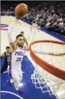  ?? CHRIS SZAGOLA — THE ASSOCIATED PRESS ?? The 76ers’ Ben Simmons goes up to dunk during the first half Saturday.