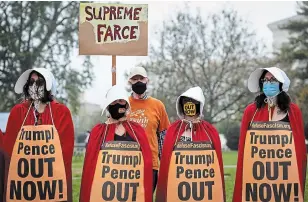  ?? PETE MAROVICH THE NEW YORK TIMES ?? Demonstrat­ors, some, dressed as characters from the “Handmaid's Tale” protest the nomination of Judge Amy Coney Barrett to to the Supreme Court, in Washington, D.C., on Thursday.