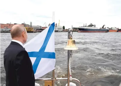  ?? THE KREMLIN VIA AP ?? In this photo provided by the Kremlin, Russian President Vladimir Putin attends the launch ceremony for Mekanik Sizov, a super trawler belonging to a company partly owned by sanctioned businessma­n Gleb Frank in St. Petersburg, Russia. Two of Russia’s largest seafood exporters — Vladivosto­k-based Russian Fishery Co. and Russian Crab — are owned by Frank, the son of Putin’s former transporta­tion minister and head of state-owned shipbuilde­r Sovcomflot.