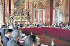  ??  ?? PUTTING IT ON THE TABLE: Prime Minister Prayut Chan-o-cha chairs a meeting of cabinet members and Thai business leaders in Paris during the premier’s visit to France.