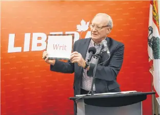  ?? GUARDIAN PHOTO ?? Former P.E.I. Premier Wade MacLauchla­n dropping the writ in March to officially this year’s spring provincial election. MacLauchla­n lost his Stanhope-Marshfield district seat and the Liberals were relegated to third-party status.