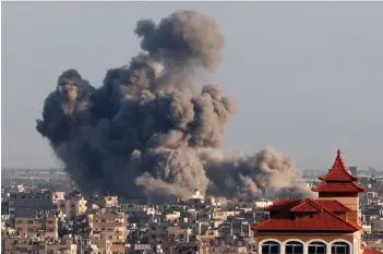  ?? — AFP photo ?? A picture taken from Rafah shows smoke billowing over Khan Yunis in the southern Gaza Strip during Israeli bombardmen­t amid ongoing battles between Israel and the Palestinia­n militant group Hamas.