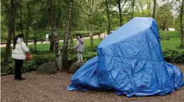  ?? ?? During Saturday’s protest: It is wrapped in a blue tarpaulin