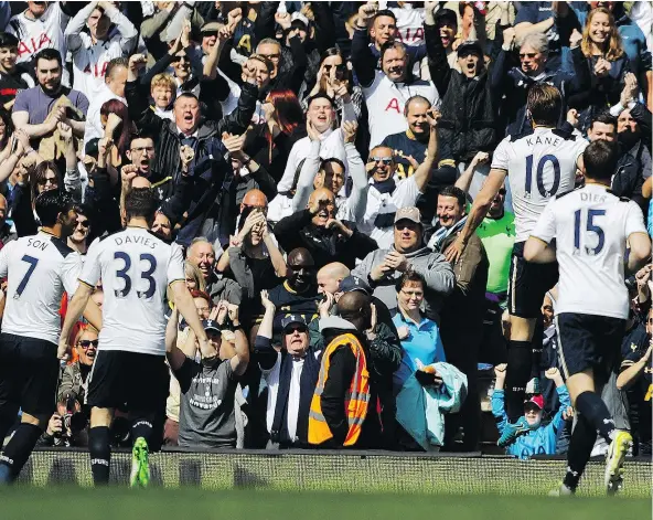  ?? — THE ASSOCIATED PRESS FILES ?? Tottenham players celebrate after scoring against Bournemout­h at White Hart Lane stadium earlier this month. Spurs will continue to ratchet up the revelry as they host the final North London derby at their longtime home stadium on Sunday.