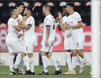  ??  ?? Al Sadd players celebrate their 3-0 win over Al Ahli in the QNB Stars League at the Jassim Bin Hamad Stadium on Saturday.