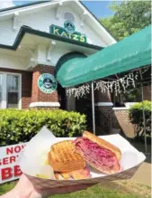  ??  ?? Katz’s New York Deli puts a twist on its Reuben, the most-popular sandwich on its menu. Rather than sauerkraut, Katz’s Reuben layers fork-tender corned beef with pickled red cabbage.